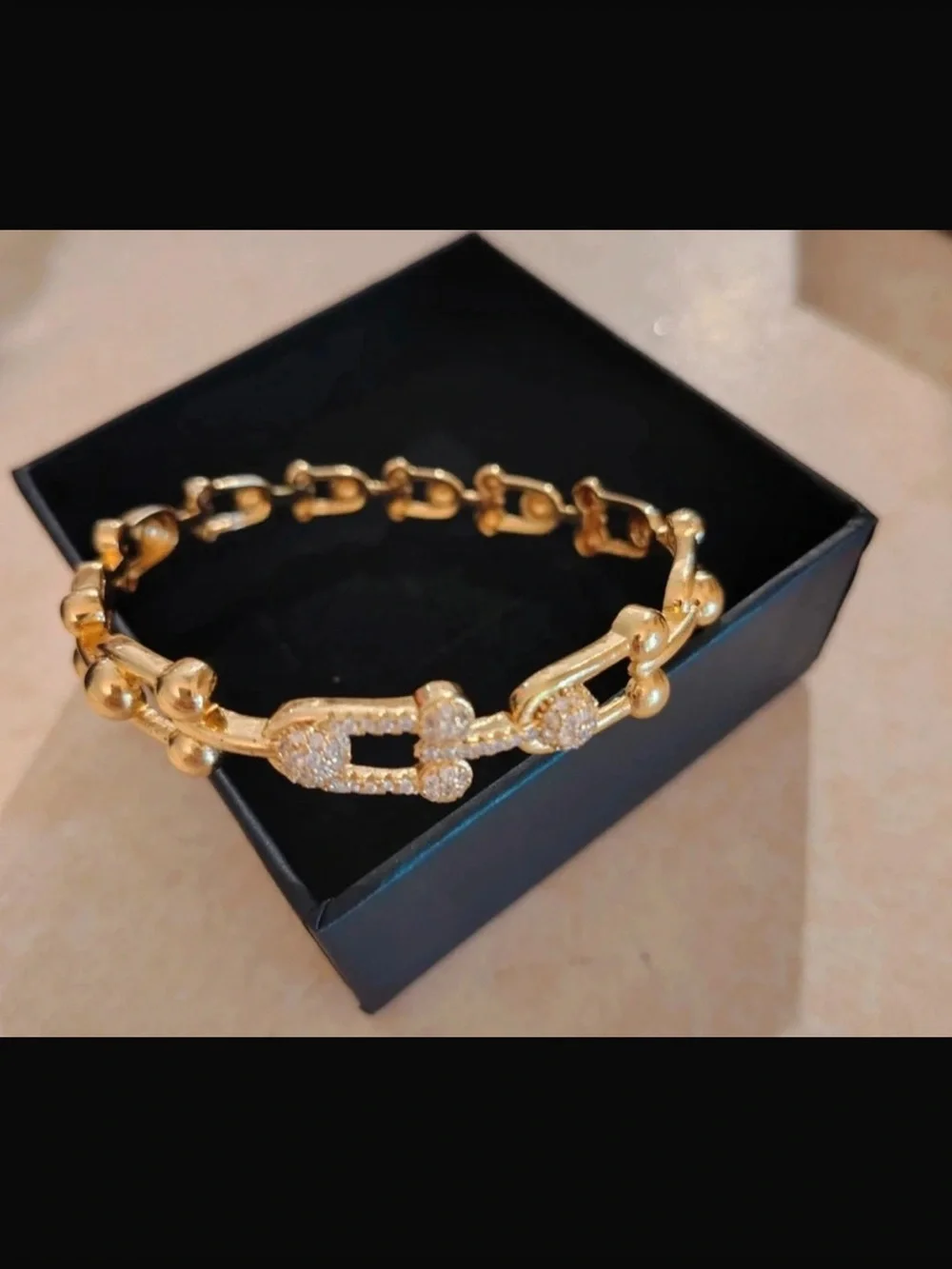 Goldtone bracelet.